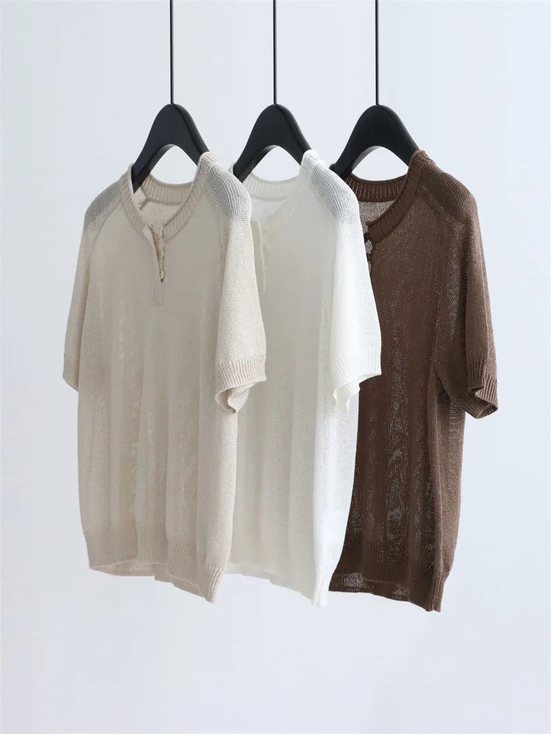 Retro bohemian short-sleeved knitted top with round neck and half-button front, suitable for summer office wear as a pullover.